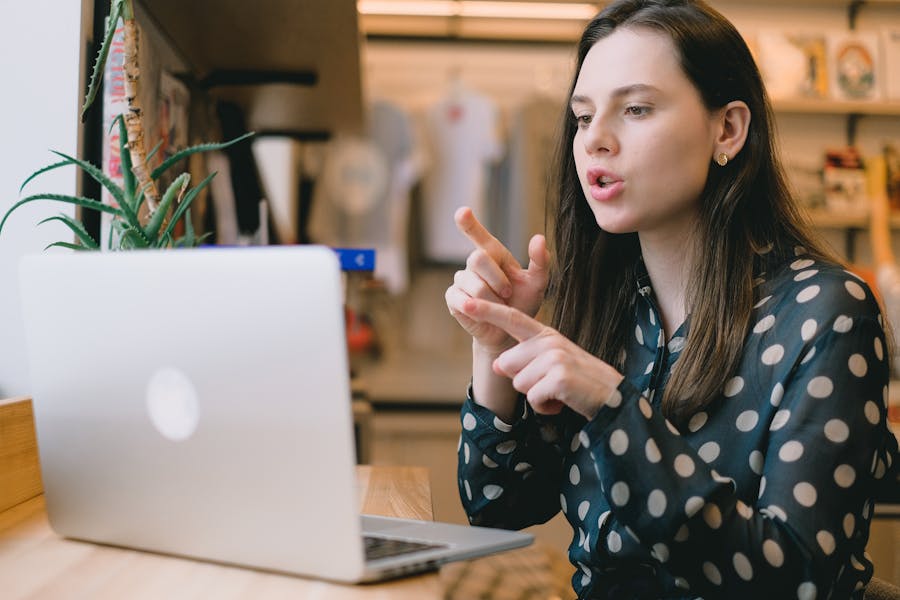 Focused businesswoman discussing strategy during an online video conference call.